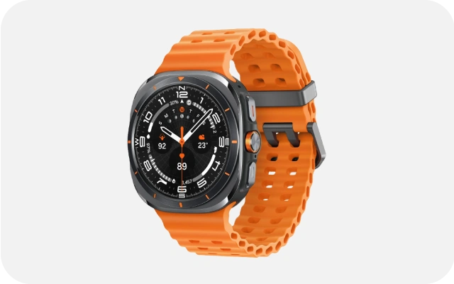 Viedpulkstenis Galaxy Watch Ultra (2025) ar oranžu siksniņu un melnu ciparnīcu, kurā redzams laiks, datums, akumulatora līmenis 35%, temperatūra 23°C, pulss 89 bpm un citi sensordati.