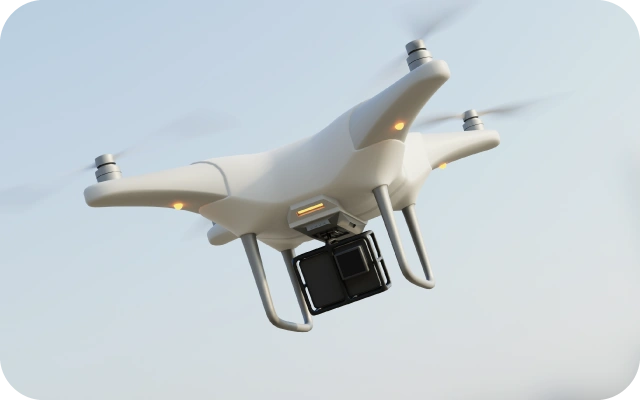 Balts drons ar kameru un LED gaismām lido debesīs.
