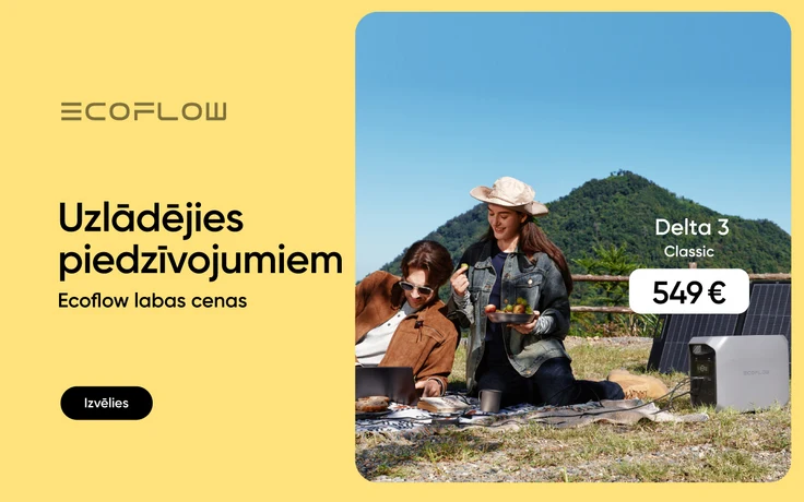 Sieviete un vīrietis atrodas dabā uz piknika segas, sieviete tur rokās augļu bļodu, vīrietis izmanto portatīvo datoru, kura uzlādes vads pievienots blakus esošajam EcoFlow Delta 3 Classic elektrostacija un saules panelis; cena 549 €.